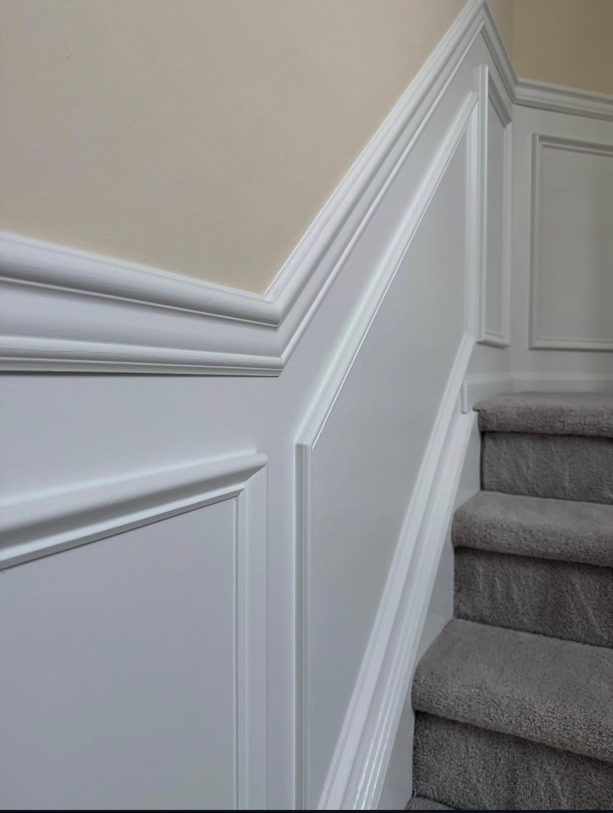 Freshly painted white stairway trim