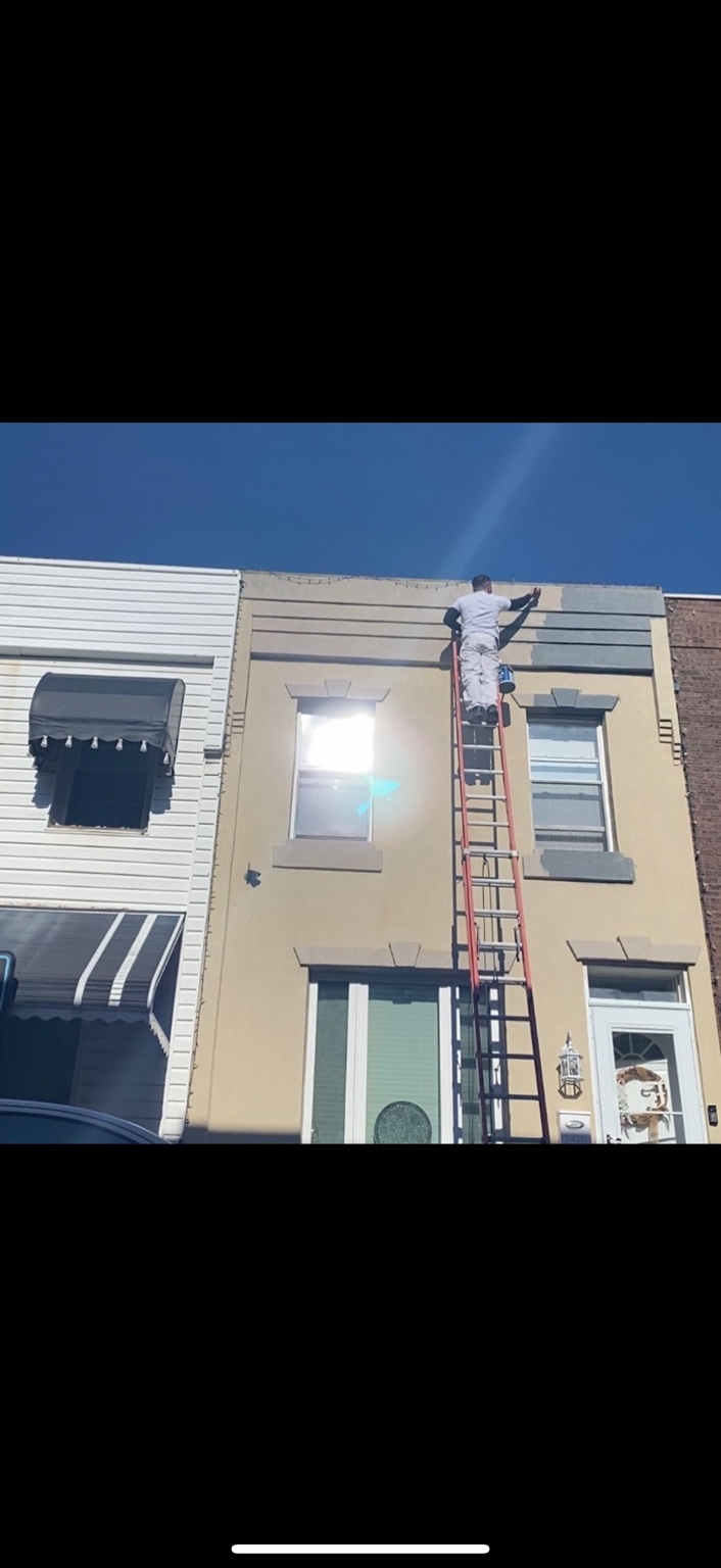 Painter working on a home exterior