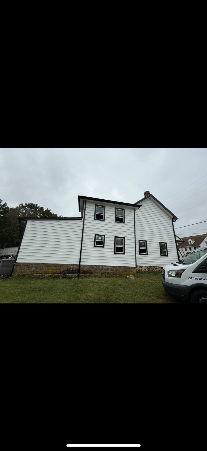 White painted house exterior with black trim