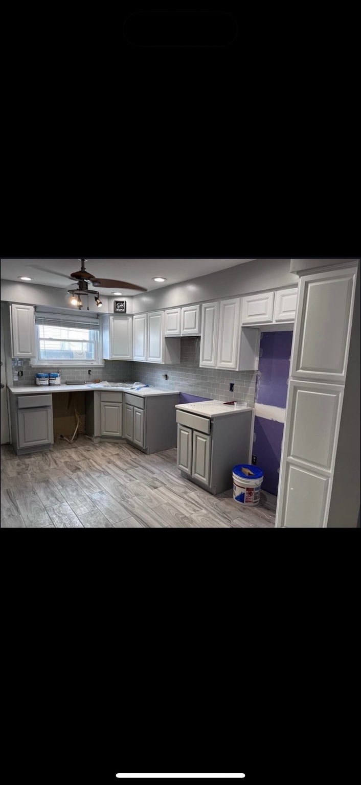 Two-tone refinished kitchen cabinets